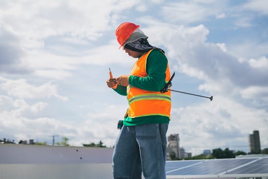 A solar panel installation team working on an urban roof